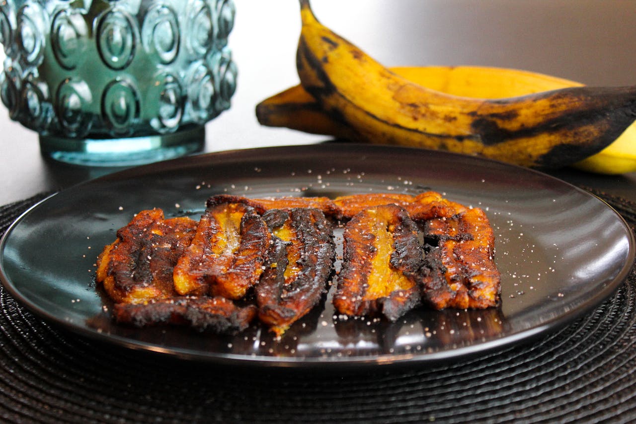 Cooked Food on Black Ceramic Plate